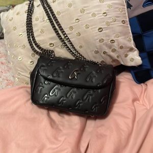 Glamaholic Black Monogram mini flap bag.
